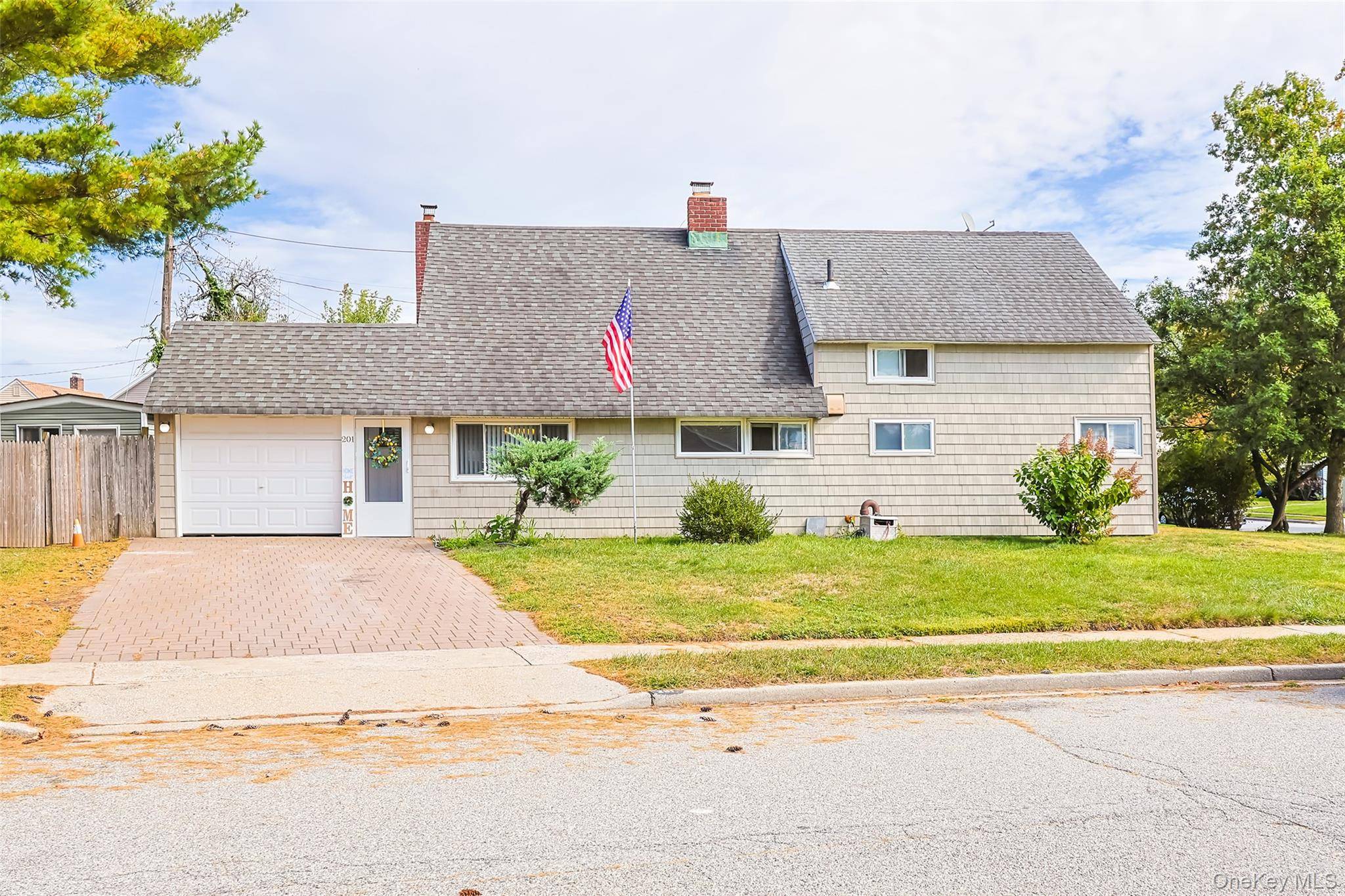 Welcome to this expanded ranch nestled in the quiet neighborhood of Levittown !