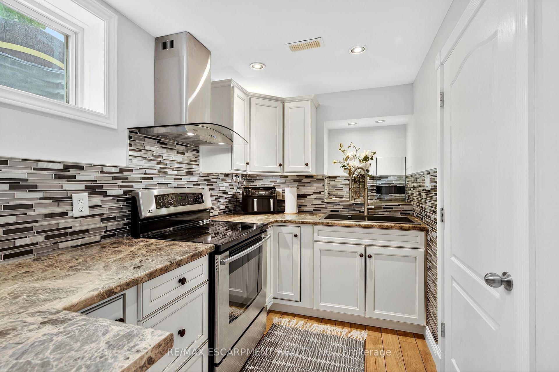 This quality John Bruce Robinson built home is situated on a tree lined street with no sidewalks.