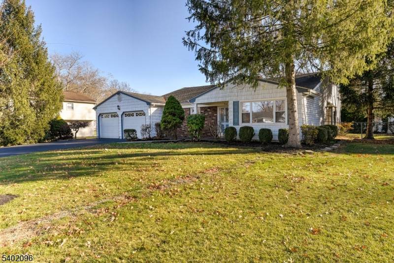 Lovely sun filled expanded Ranch in Brunswick Acres greets you w charming brick front, inviting front porch mature trees.