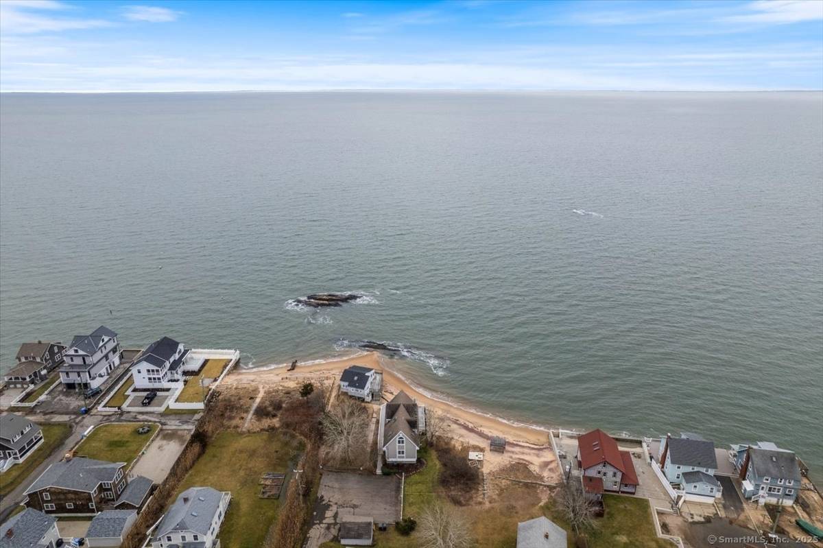 Just Steps from the Sand Your Coastal Retreat Awaits !