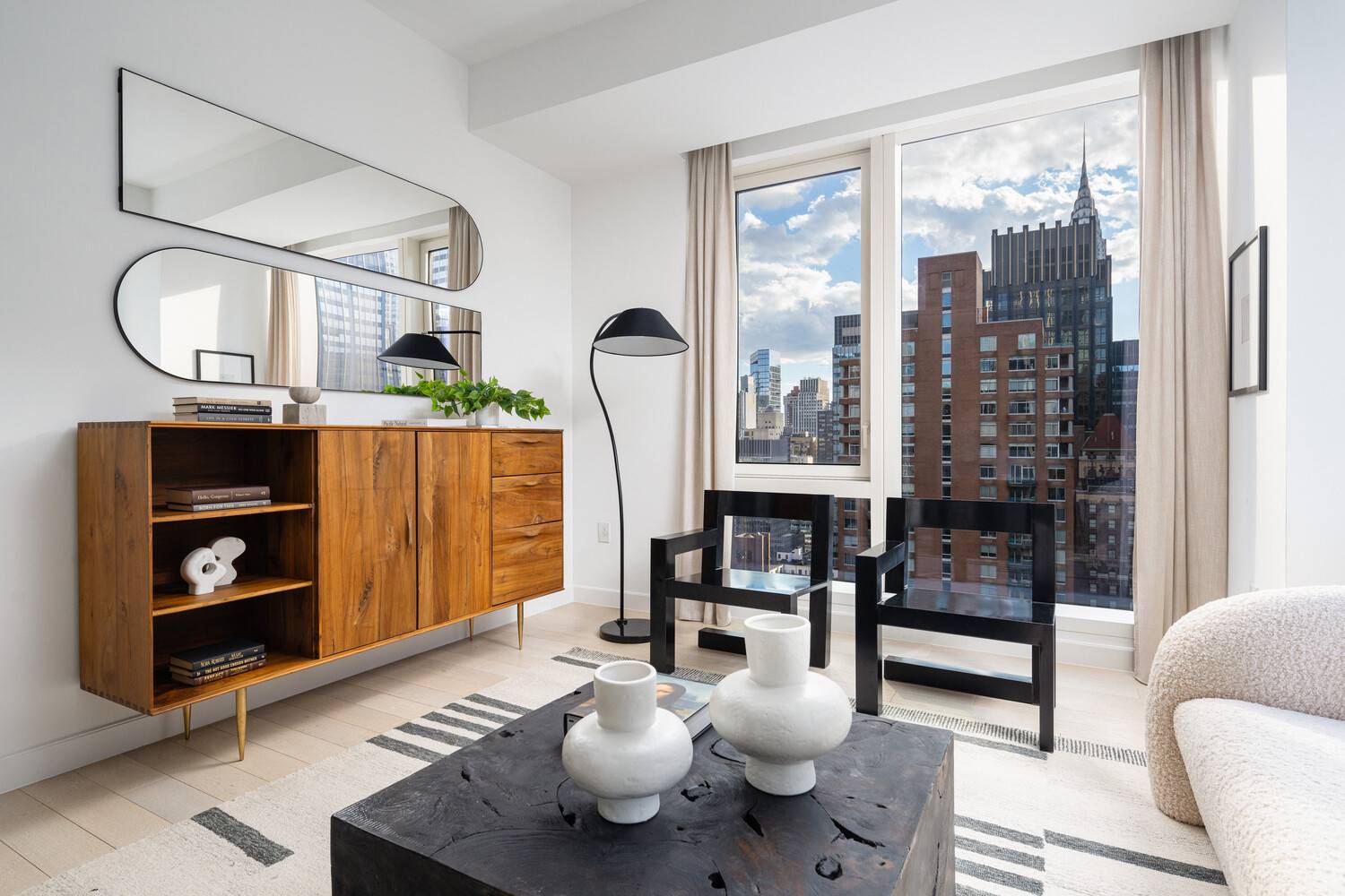 Immediate Occupancy. This expansive one bedroom, one and a half bathroom residence designed by Champalimaud offers northern, western, and southern exposures through floor to ceiling windows.