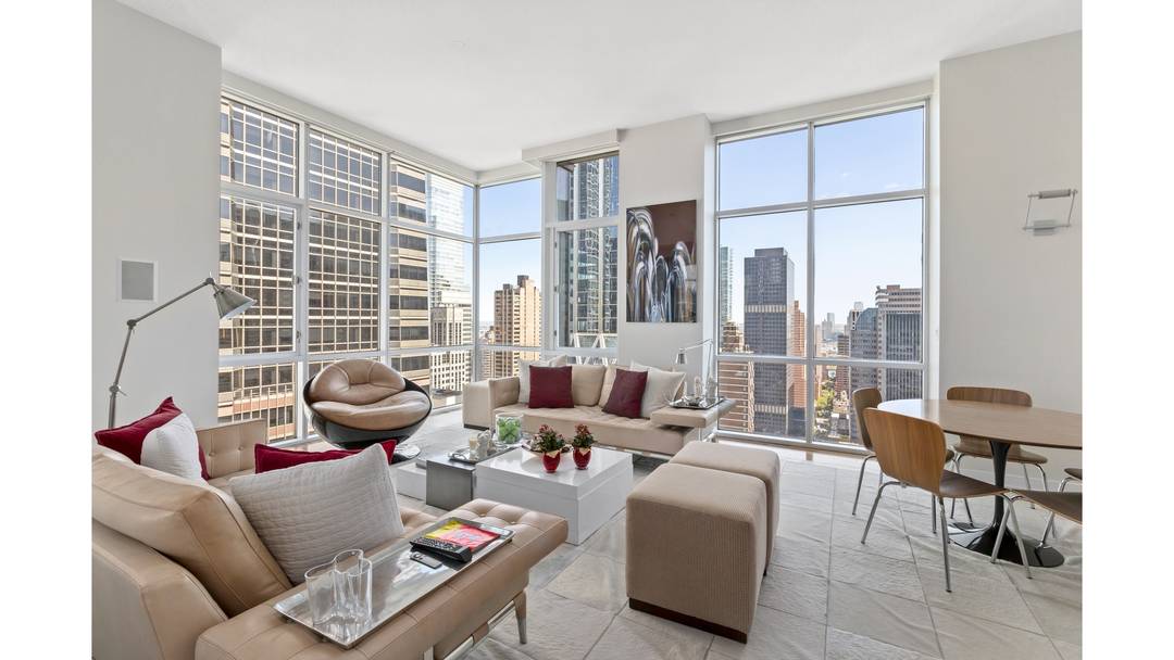 Elegant Corner Penthouse with Expansive Views in Prime Midtown Perched high above East 55th Street between Park and Madison, this stunning corner penthouse offers an exceptional blend of light, space, ...