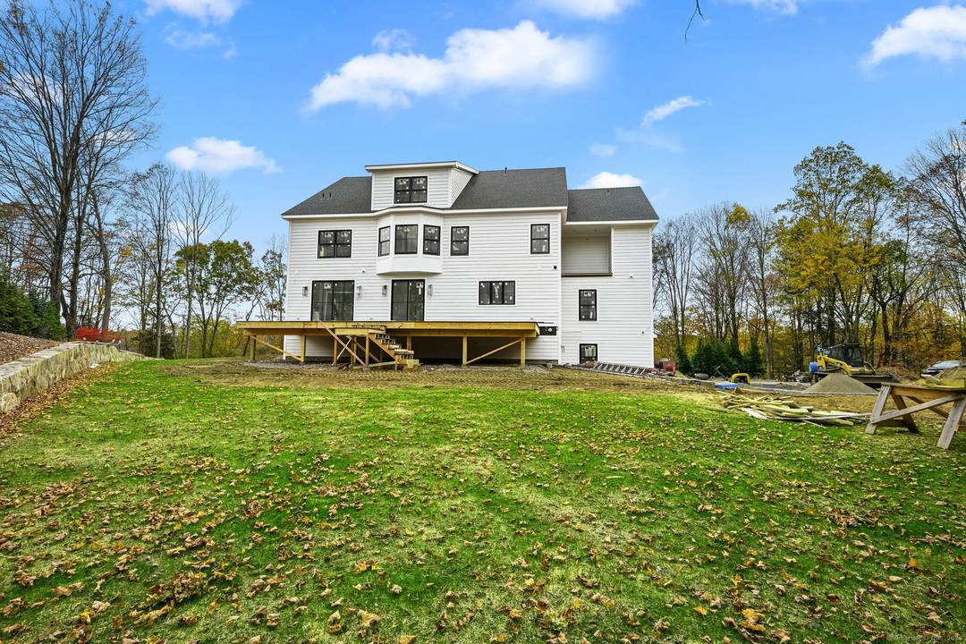 Welcome to 150 Wildwood Road, an exceptional new construction residence that perfectly blends timeless colonial architecture with modern sophistication.