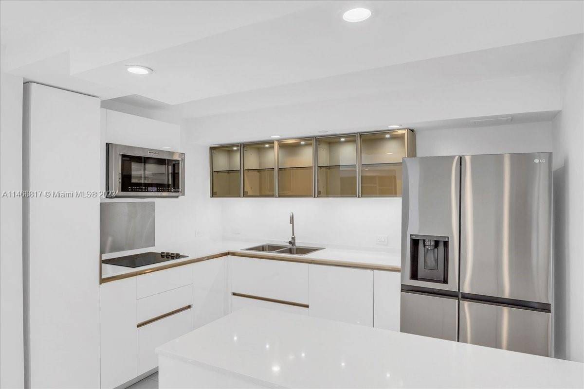 Delightful and expansive view of the waterfront from your living room and balcony.