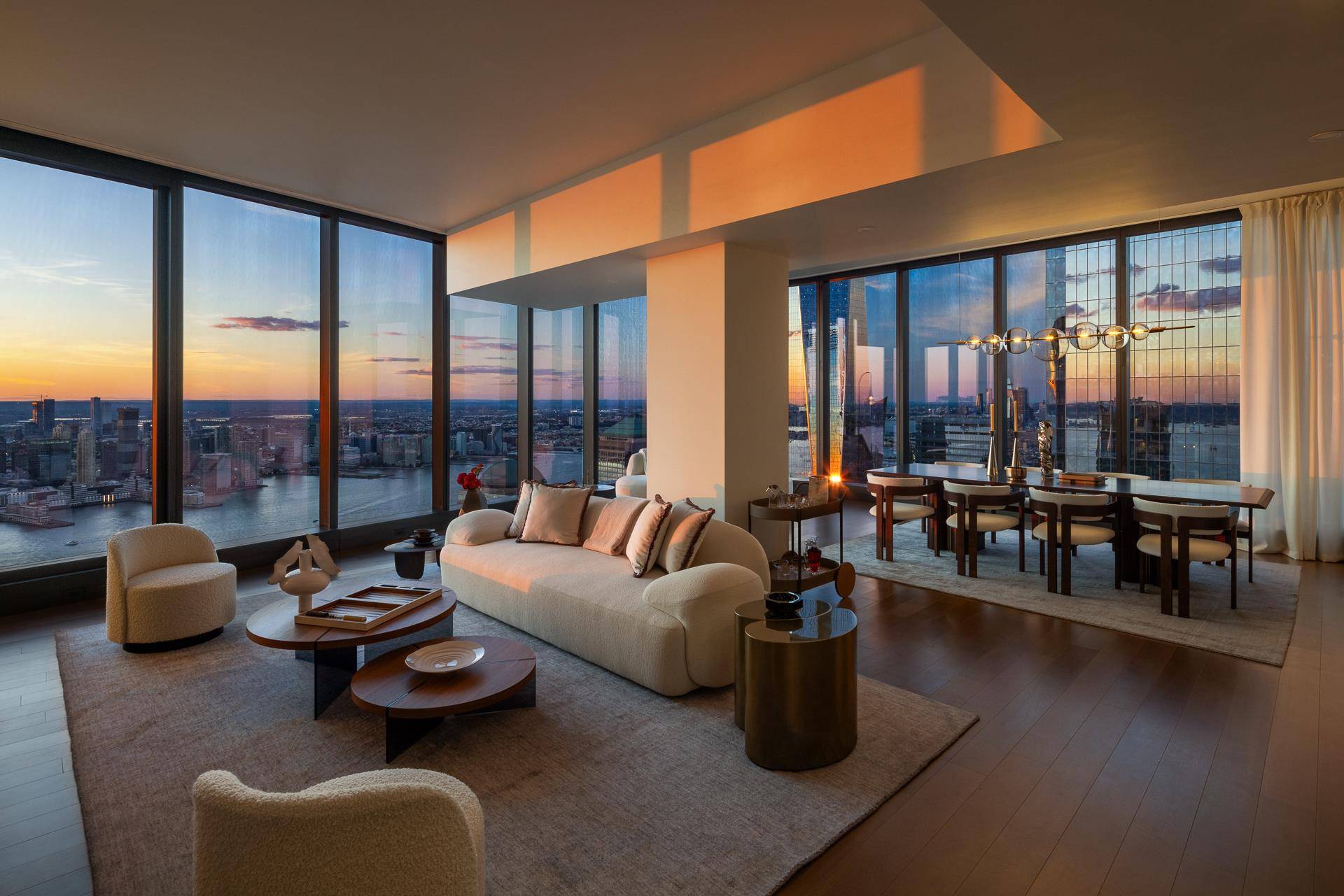 Bathed in sunlight and jaw dropping, this half floor penthouse residence, soaring high above the Hudson River, epitomizes modern luxury.