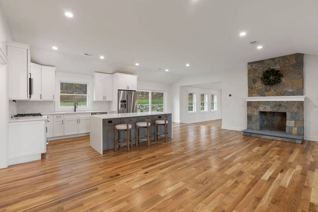 Completely remodeled with new additions, versatile living spaces and elevated finishes, this redesigned farmhouse split is truly turn key and feels like a brand new home.