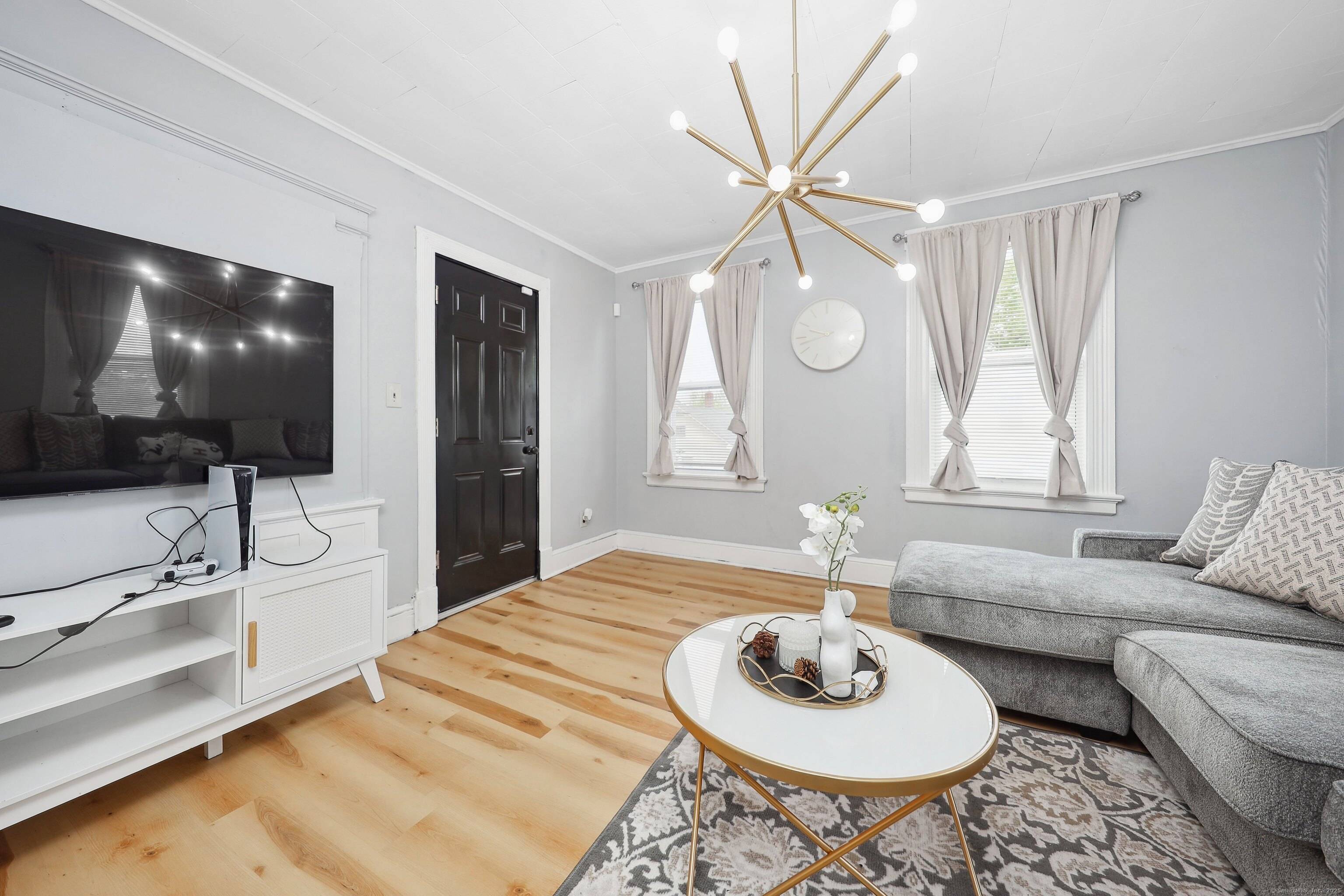 CASH FLOW on day one ! Rare 10 Car Garage with new roof is included with this fully rented 3 family home !