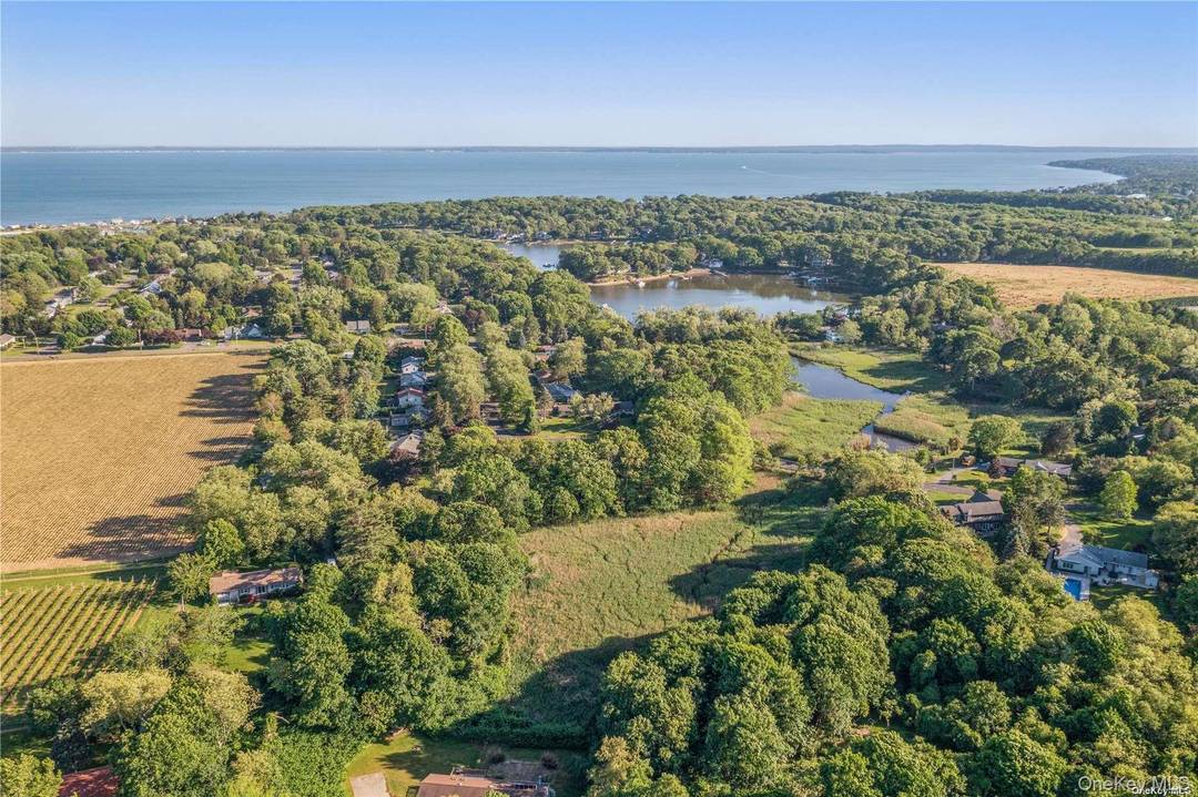Tucked away on a serene cul de sac in the heart of Mattituck, this prime, shy wooded acre offers a rare blend of privacy, natural beauty, and opportunity.