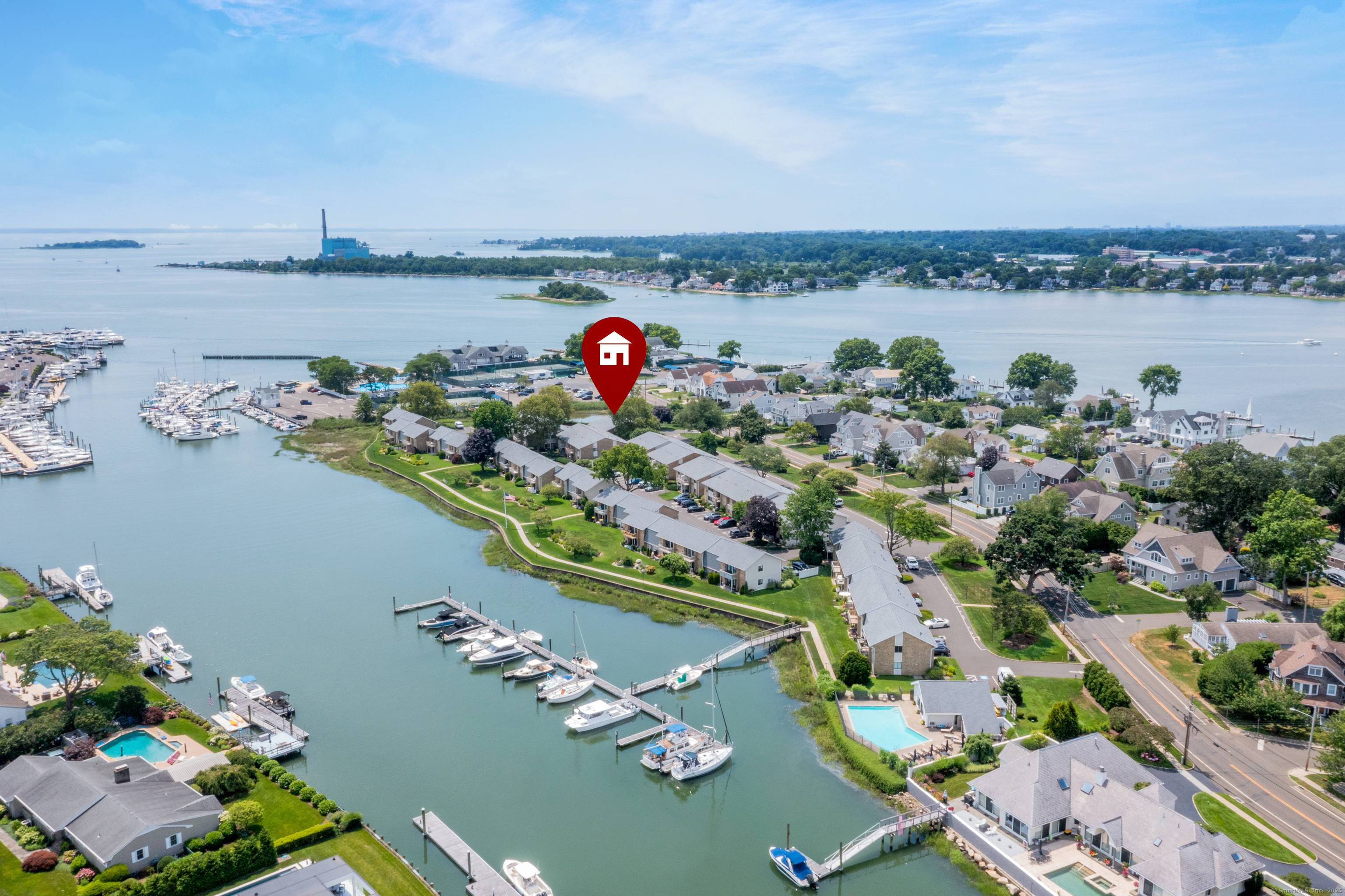 Welcome to this sunny and bright corner unit with water views over Long Island Sound.
