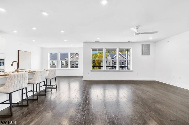 Top floor, single level condo no stairs with elevator access offering 3 bedrooms, 2 full baths, and an open, light filled layout.