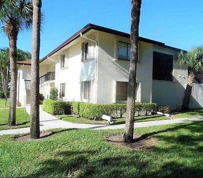 Desirable 2nd floor corner unit with a fabulous pond view from your screened enclosed patio.
