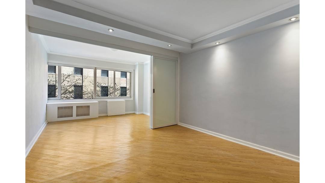 A generously proportioned residence intelligently converted into a true one bedroom with an additional den office in one of Sutton Place's most well managed coops.