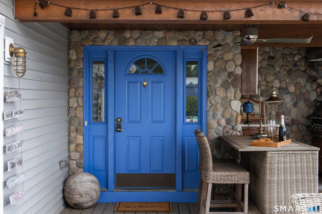 Welcome to this gorgeous, fully renovated Ranch style retreat with stunning views of Candlewood Lake.