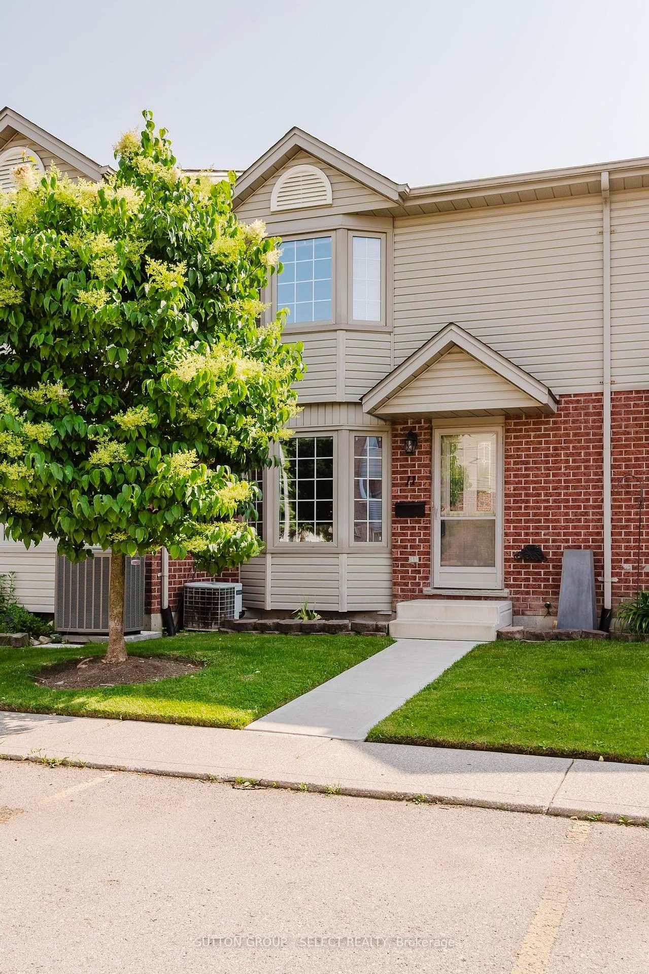 Welcome to this charming low maintenance townhouse condo, perfectly nestled in a quiet neighborhood.