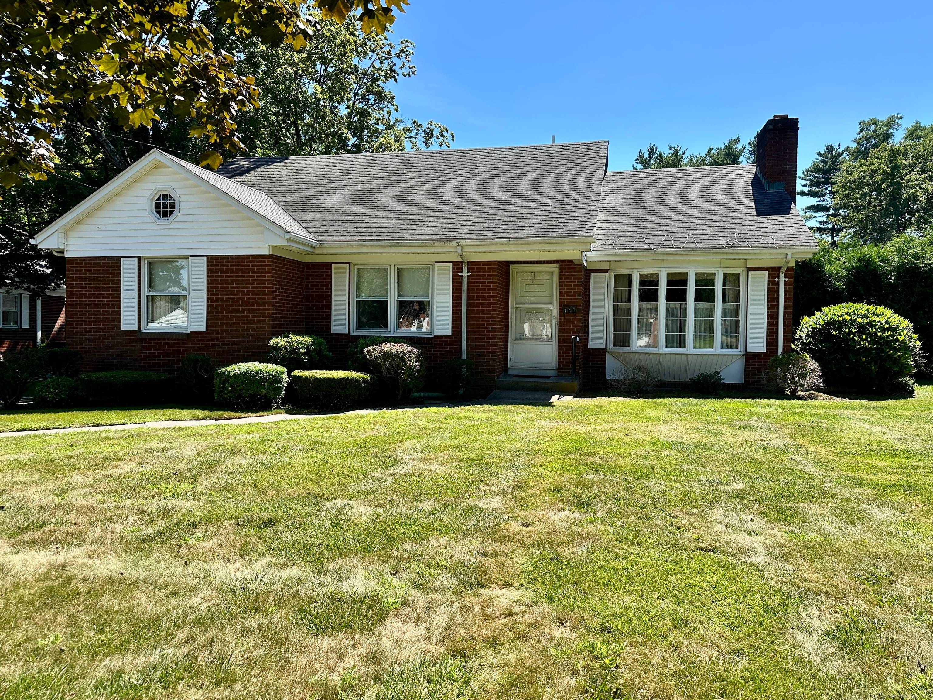 Welcome to 137 Elm St. A custom built, original owner brick cape nestled in the heart of Windsor Locks.