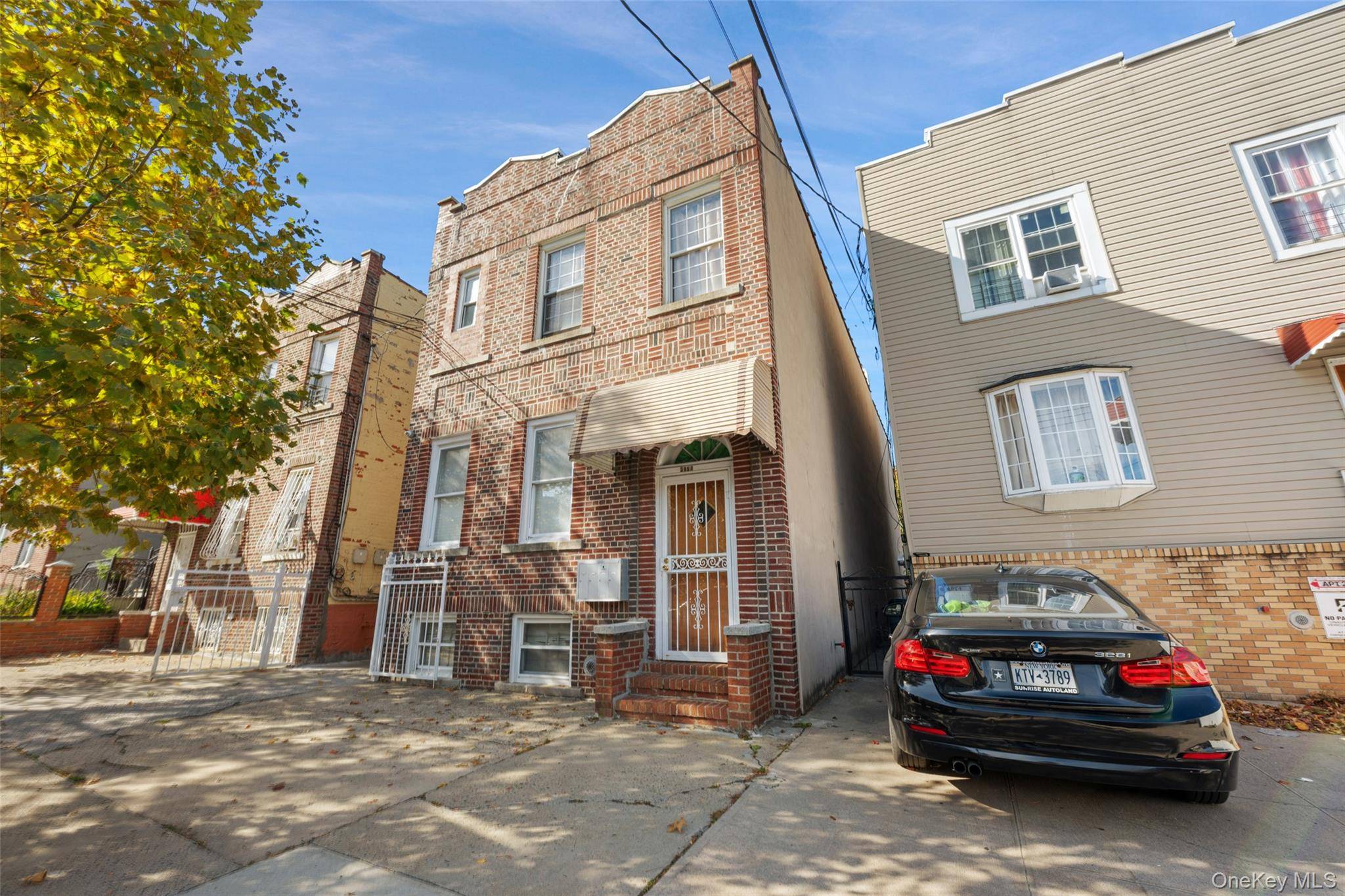 This classic detached brick three family home offers solid prewar construction, well preserved interior details, and updated living spaces across three income producing units.