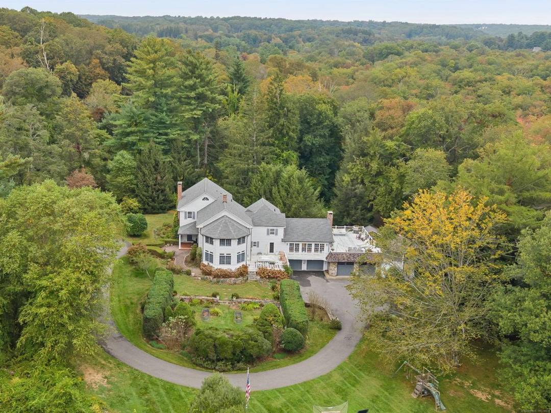 PRICED TO MOVE. Set along one of Fairfield County's most picturesque and prestigious roads, this vintage Wilton estate offers a rare blend of historic character and modern potential.