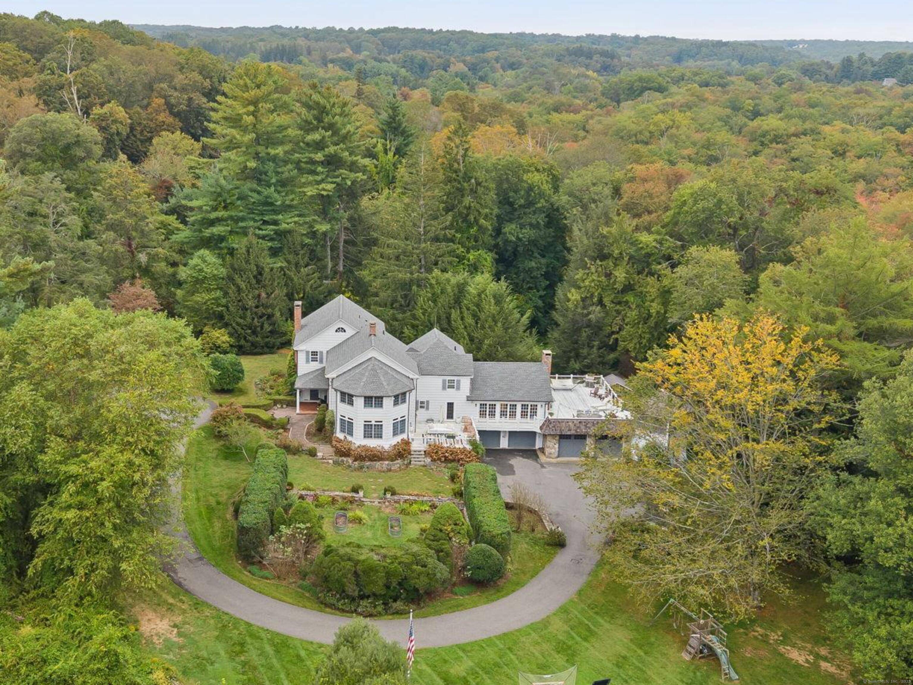 PRICED TO MOVE. Set along one of Fairfield County's most picturesque and prestigious roads, this vintage Wilton estate offers a rare blend of historic character and modern potential.
