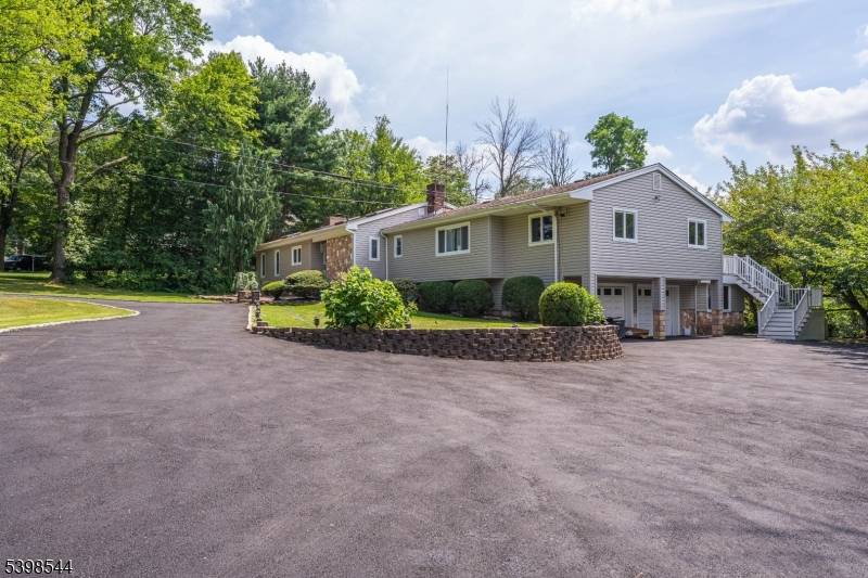 Upscale raised ranch retreat in desirable Berkeley Heights, perfect for large gatherings or entertainers.
