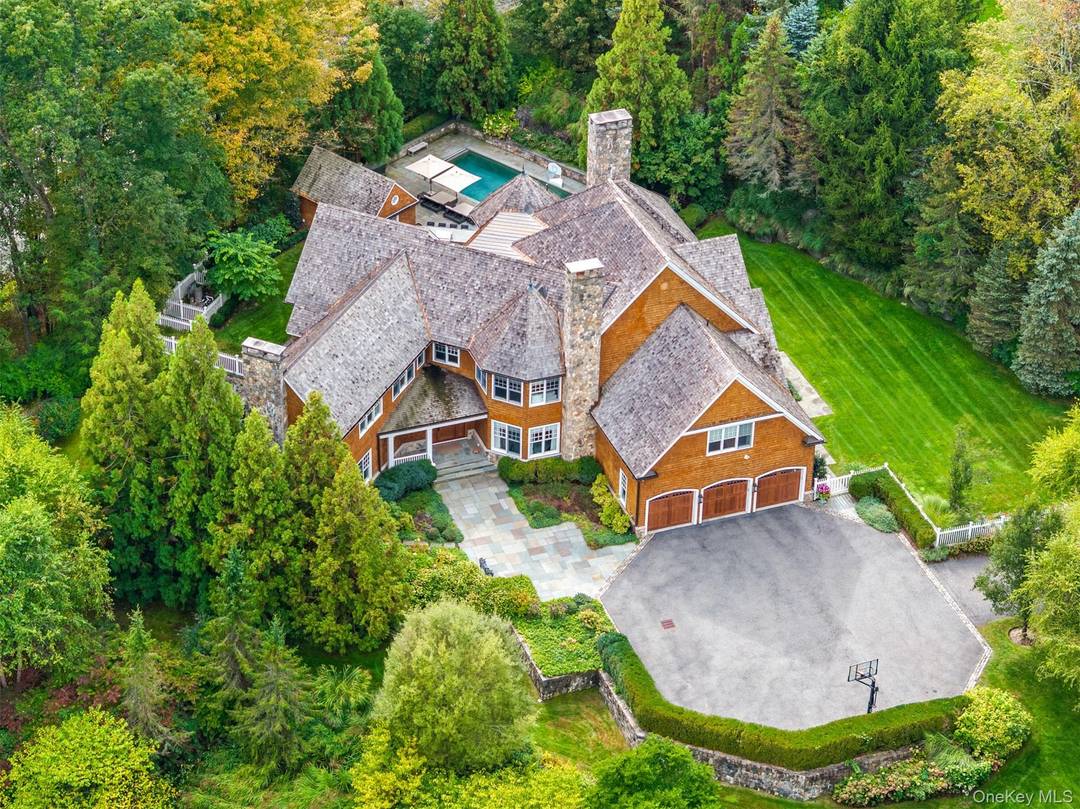 Set within Armonk s most prestigious enclave, Wrights Mill Estates, this custom Hamptons chic, stone and shingle Colonial is a masterwork of timeless elegance and resort style living.