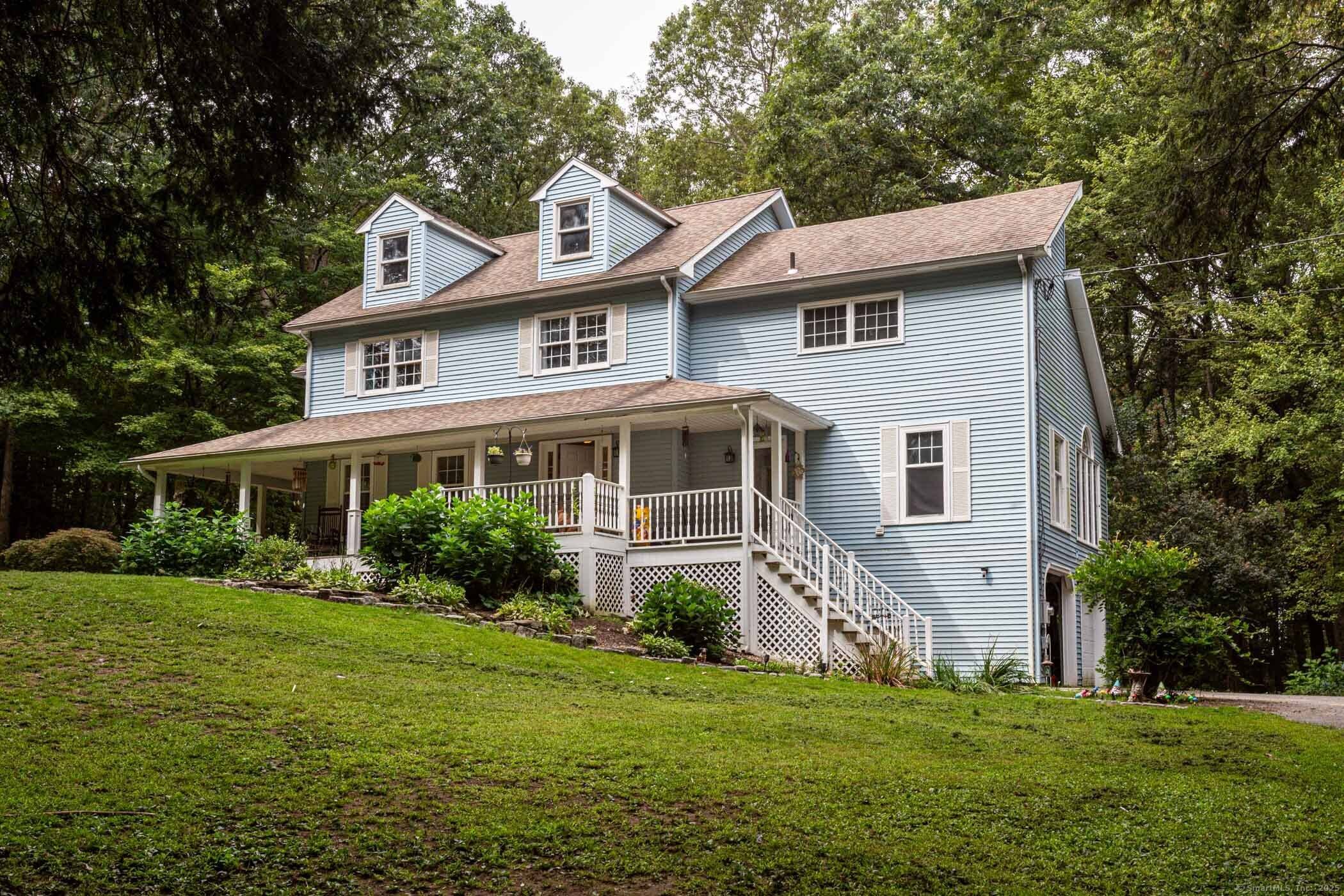 Welcome to this fantastic home, complete with a charming wrap around porch and a beautifully kept, tree filled yard that's ready to be your personal oasis.