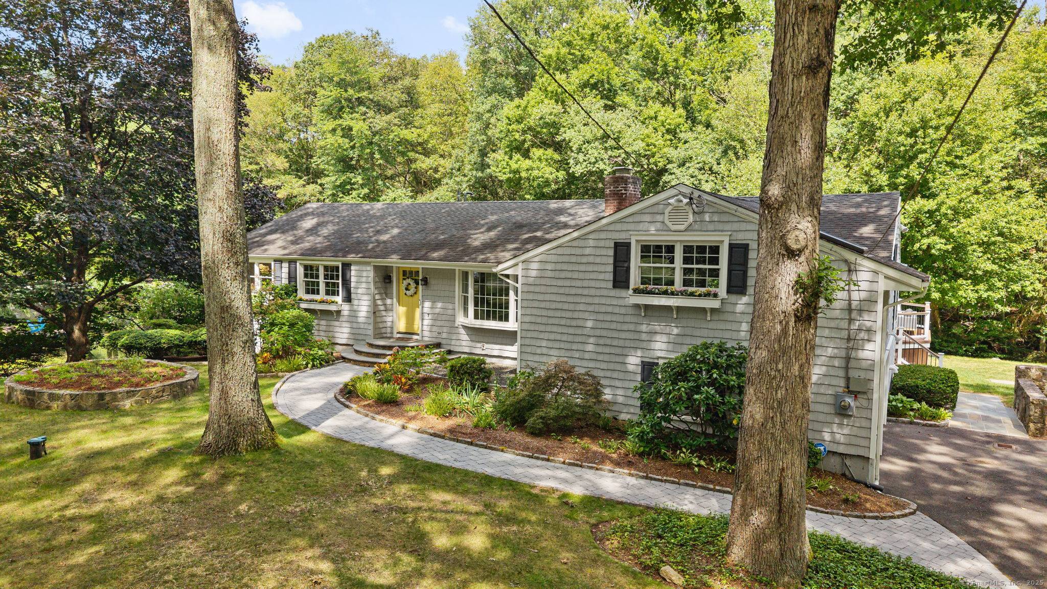 Convenience and serenity intersect at this unique lower North Stamford property on a cul de sac.