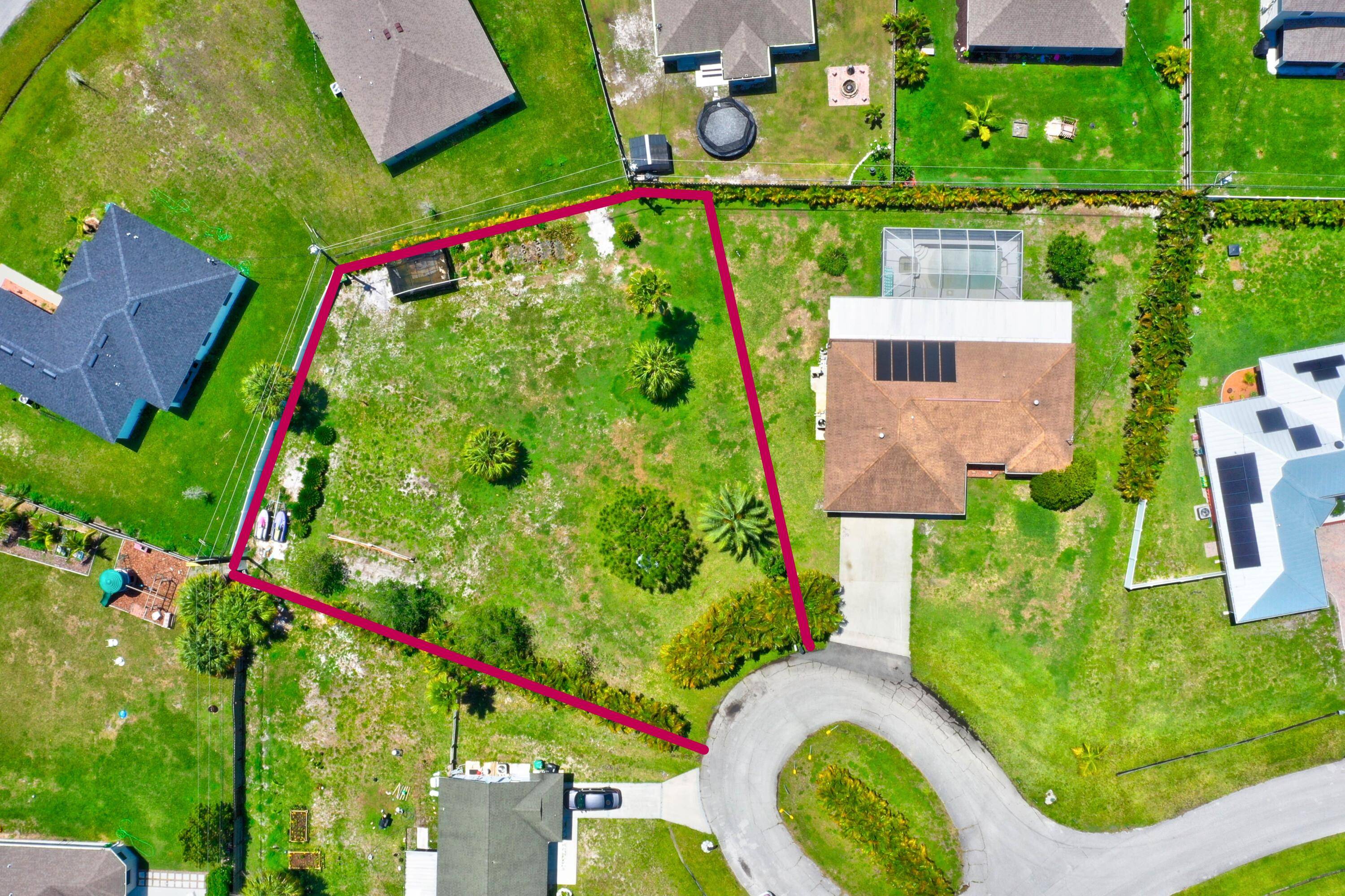 Beautiful vacant lot on a cul de sac, cleared and high ground with some Areca palm trees for privacy.