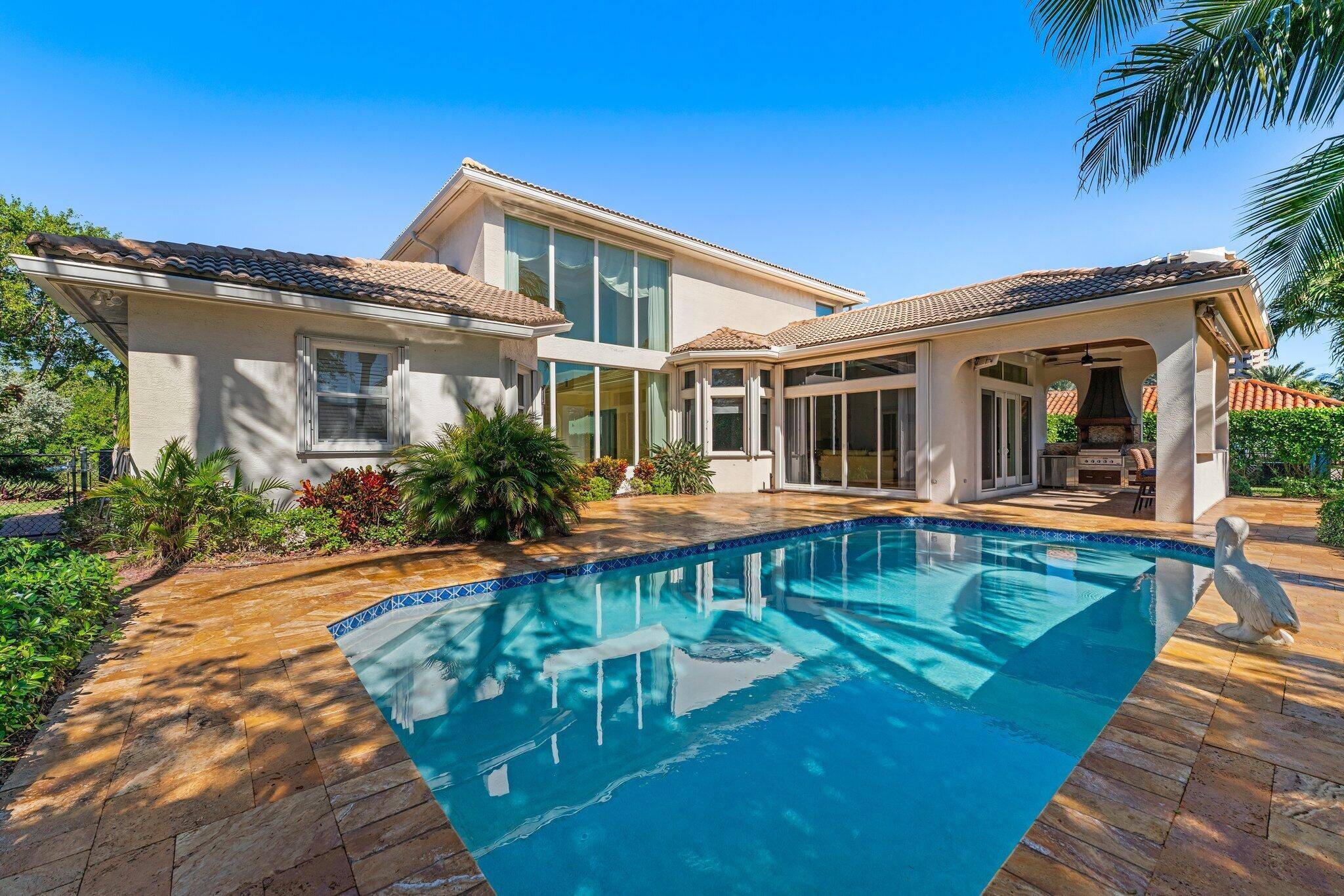 Welcome to 1231 Pine Point Rd, an exceptional fully furnished Mediterranean style coastal retreat on one of Singer Island's most sought after streets.