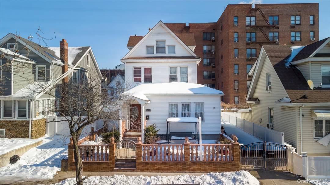 Well maintained two family property offering 4 bedrooms, 2 full bathrooms, and 2 kitchens.