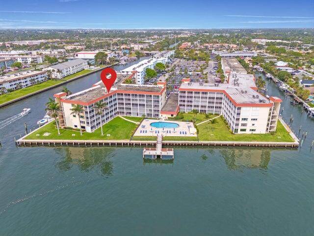MILLION DOLLAR view of WIDE Intracoastal Waterway in quaint Village of North Palm Beach Well maintained pool on the Intracoastal, Currently undergoing renovations and SOON will have NEW COMPLETE PAINT ...