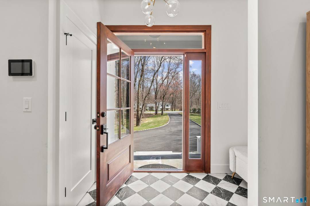 This stunning fully renovated 5 bedroom, 4 full bath home offers the perfect blend of modern design and comfortable living, set on a private 2.