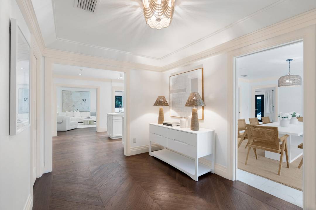 Located on a quiet street in Palm Beach's North End, this modern beach house offers 3, 803 total square feet with four bedrooms and four and a half bathrooms.