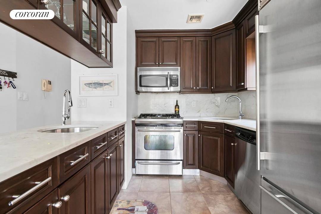 2 Bedroom Den Office and PARKING Elevator Building Welcome to 734 East 5th Street 3R, a beautifully appointed true 2 bedroom plus den office in an elevator CONDO building.