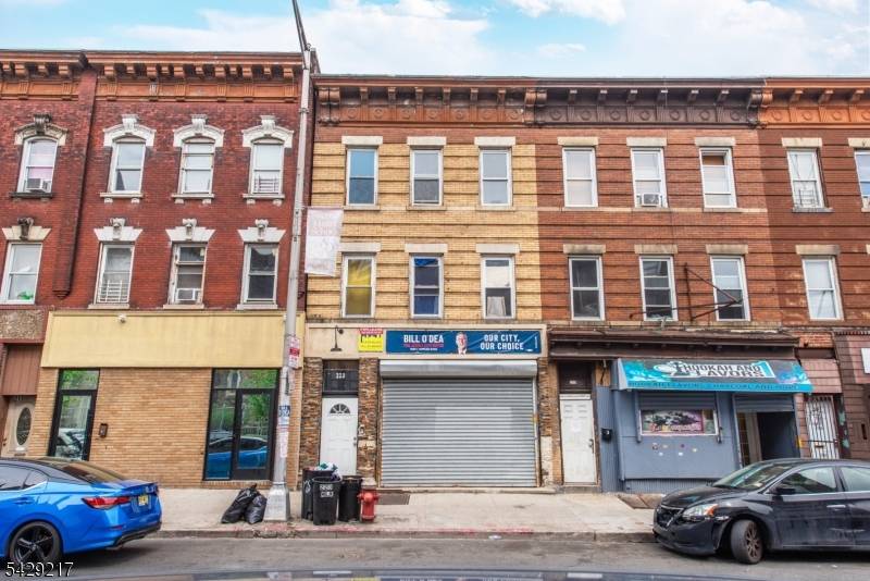 Well maintained mixed use building featuring a ground floor commercial storefront with excellent visibility and foot traffic, plus two residential apartments above.