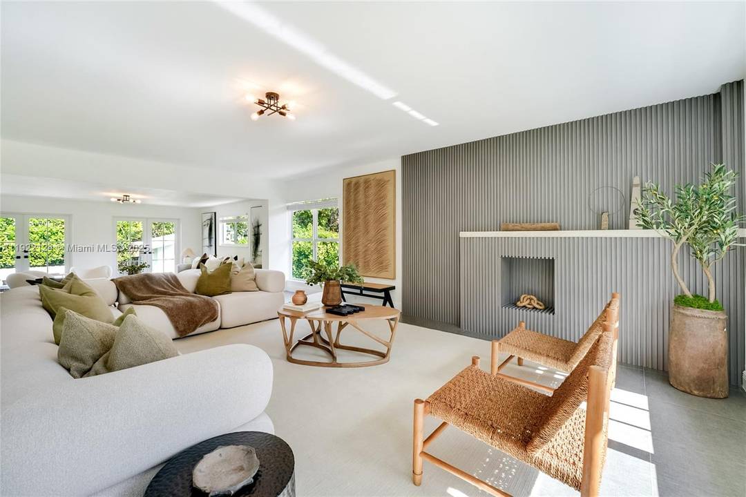 Beautifully renovated and professionally staged, this 3 bedroom den, 3 bath home is tucked away on a quiet, tree lined cul de sac in Miami Shores.