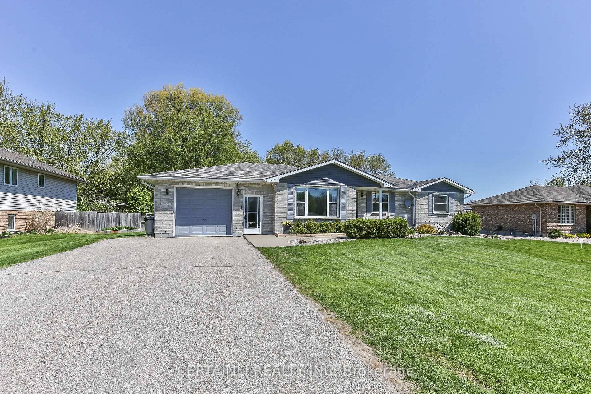Welcome to this charming 4 bedroom, 3 full bathroom bungalow nestled on just over half an acre on the sought after and family friendly Dingle Street.