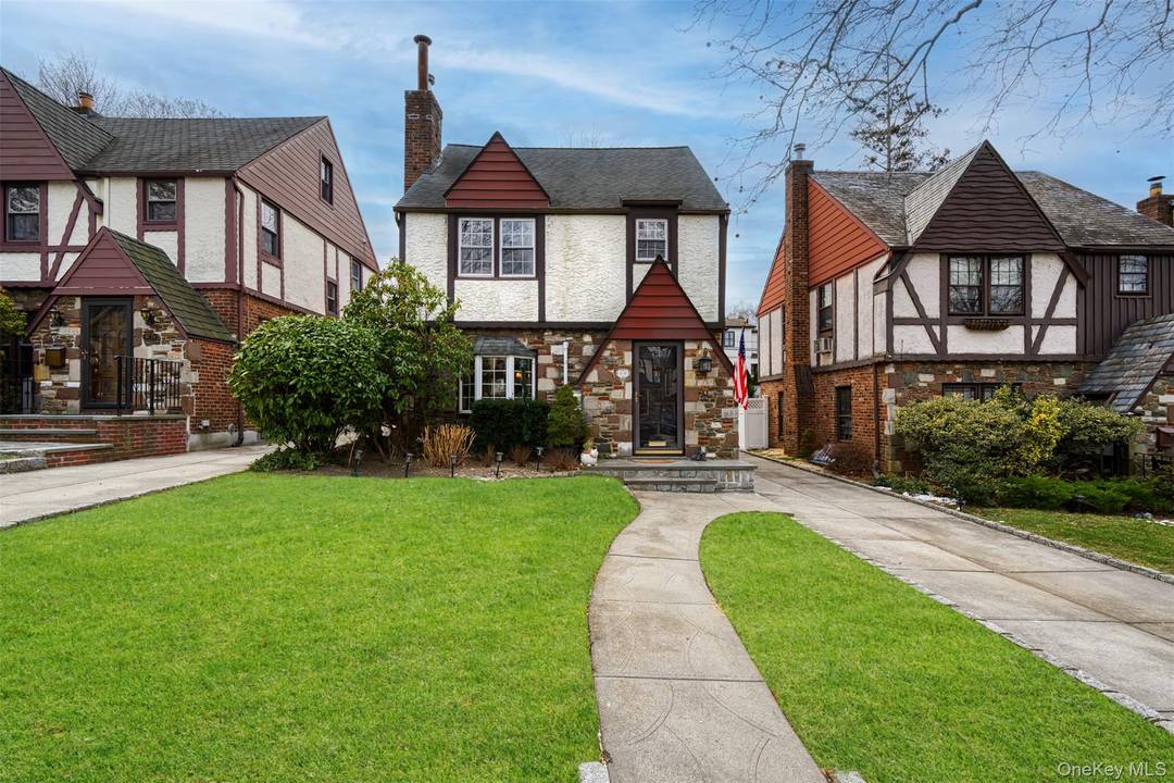 Discover the perfect blend of traditional elegance and modern updates in this beautifully maintained four bedroom, two bath Tudor style home, ideally situated in the desirable Douglaston Park neighborhood.