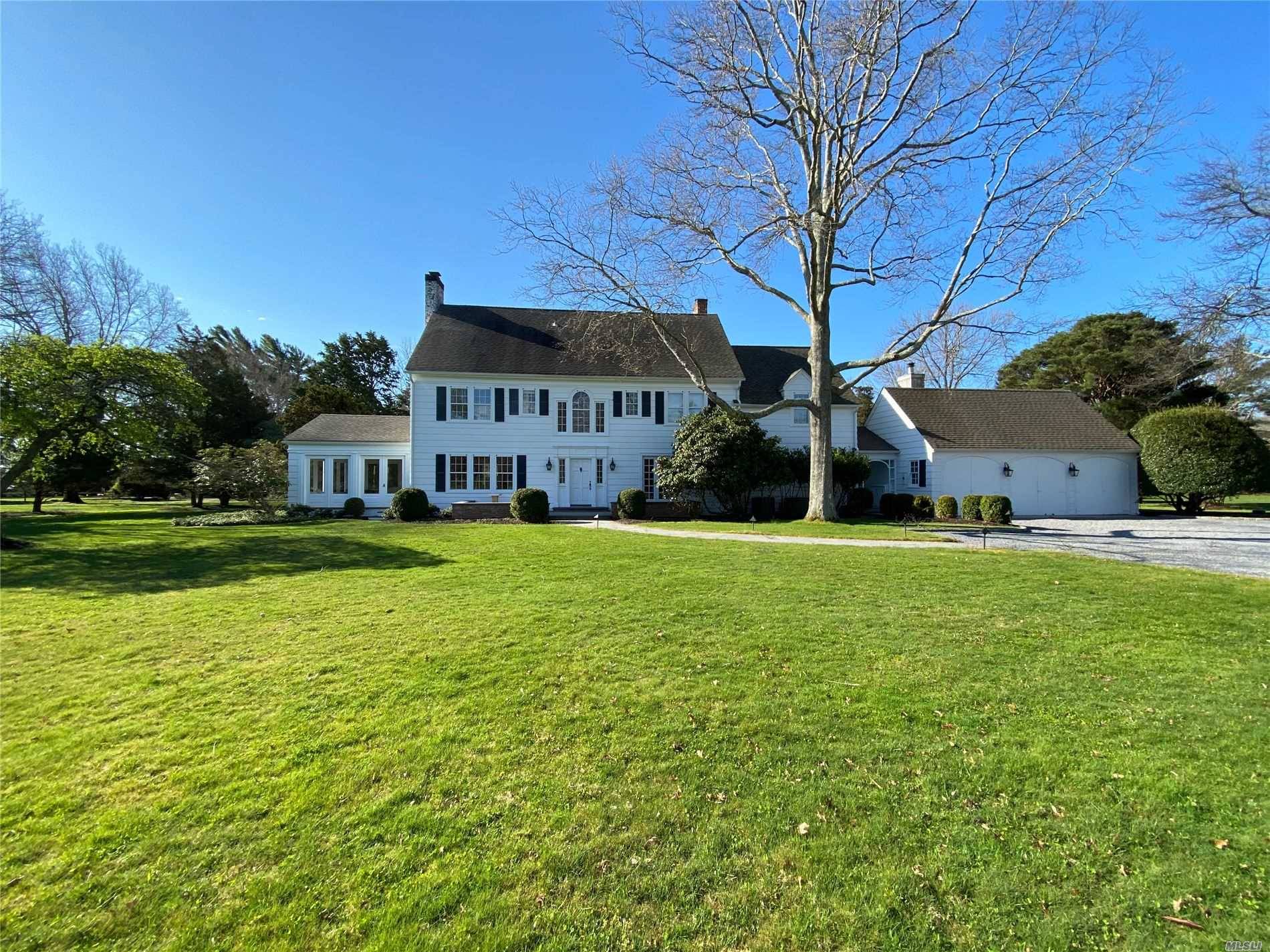 Down a private road, sits this renovated traditional home on 2.