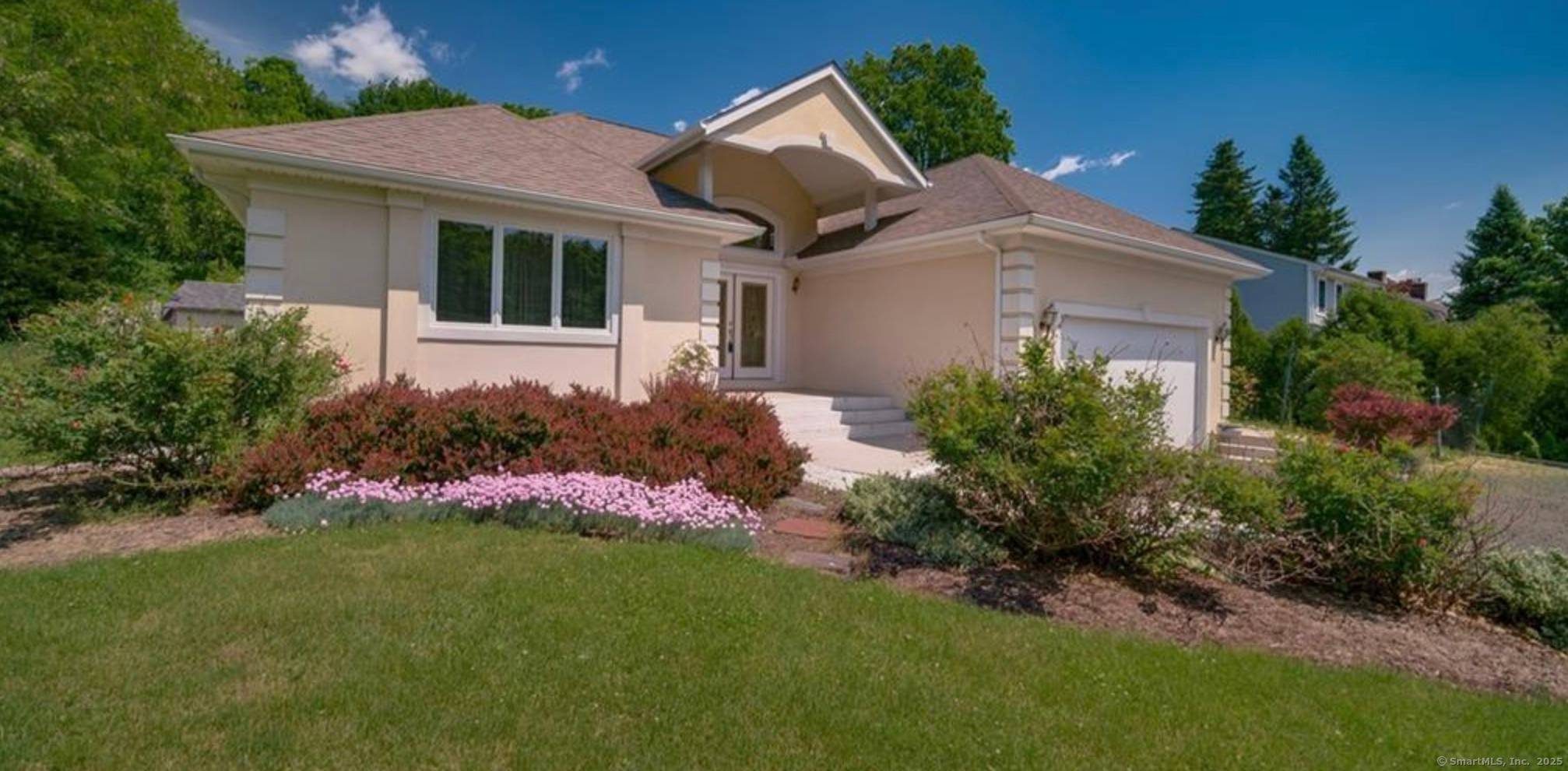 This beautifully maintained stucco two family home blends modern design with practical living.