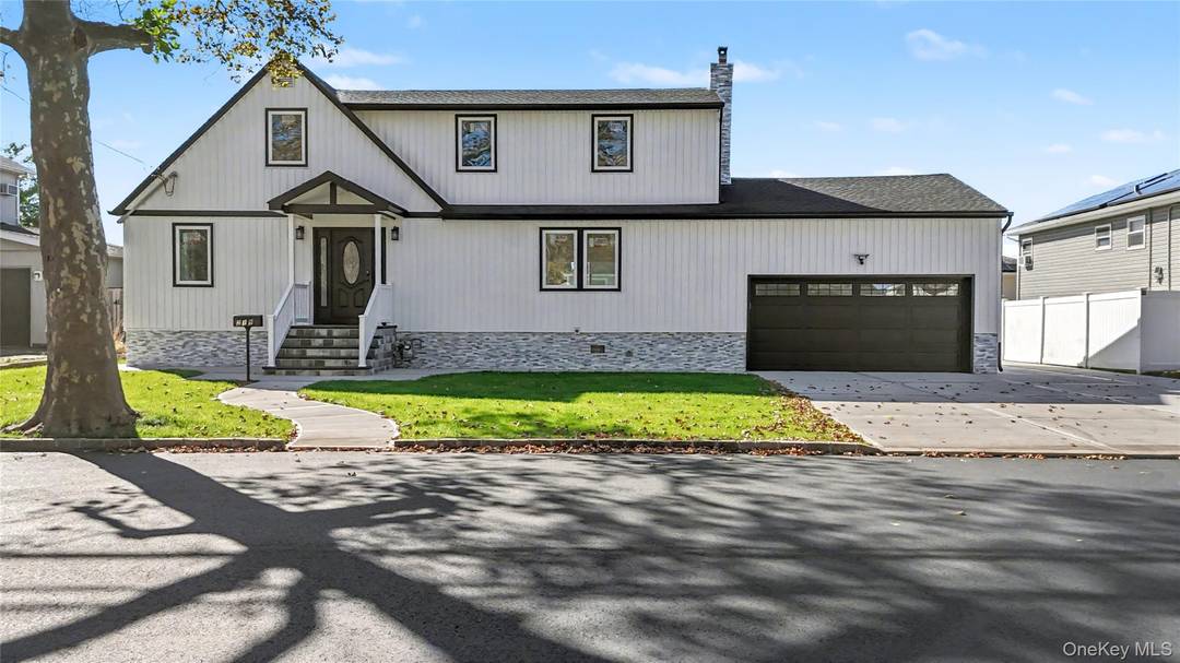 This beautifully renovated 2, 680 sq ft modern Colonial home at 219 Granada Parkway, Lindenhurst, NY 11757, is move in ready and a masterpiece of timeless elegance and modern efficiency.