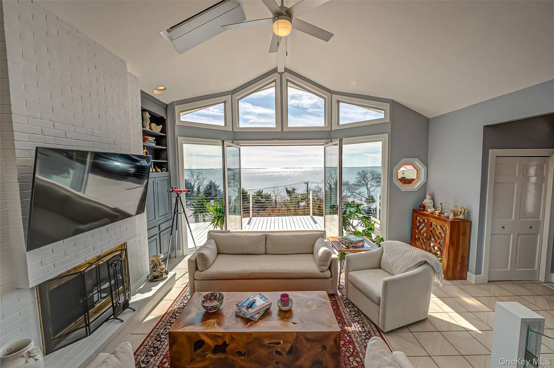 Experience waterfront living at its finest in this Hampton Bays retreat, perfectly positioned to capture sweeping views of Shinnecock Bay.
