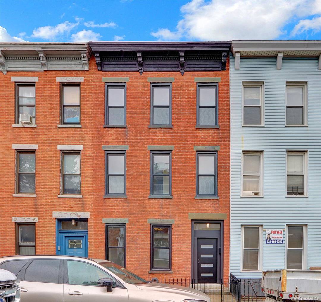This attractive triplex has a beautifully restored facade that enhances its curb appeal and neighborhood presence.
