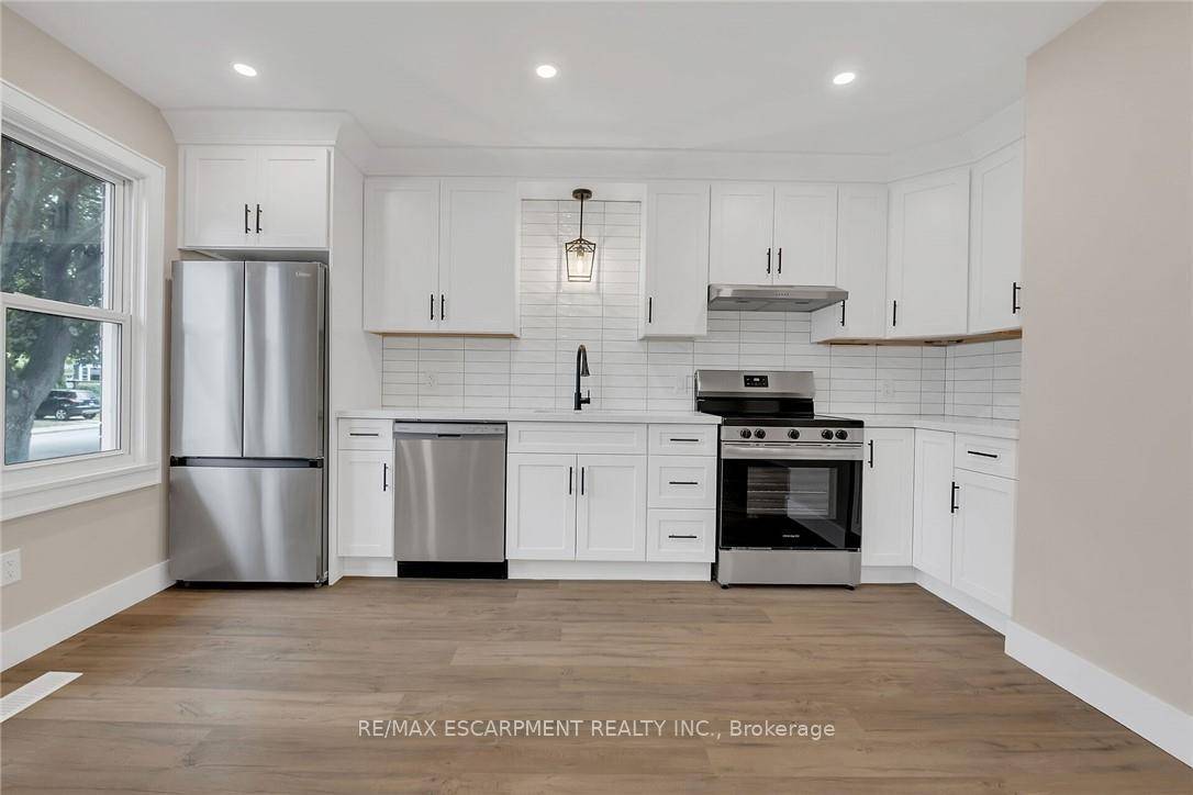 THIS ONE HAS IT ALL ! The home you've been waiting for featuring a FULL IN LAW SUITE with private side door entry !