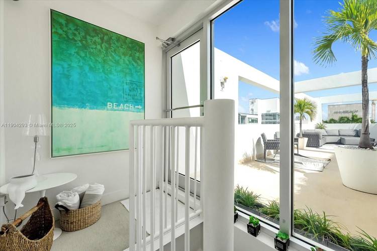 Dramatic and redefined, this sun drenched PH Loft captures the essence of modern South Beach living.