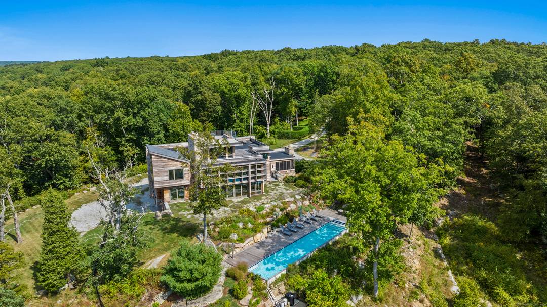 Nestled on 18 scenic acres in Lyme, Connecticut, this stunning 5, 800 square foot home is a showcase of contemporary design and sustainable living.