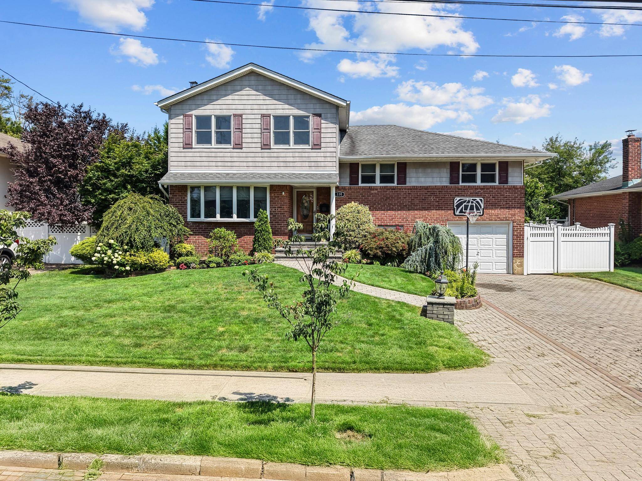 Experience refined living in this spacious and impeccably maintained split level home, ideally positioned in the desirable enclave of Garden City South.