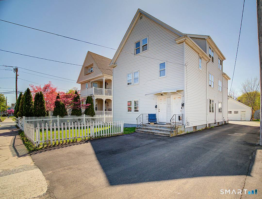 3 Family Commercial building with approximately 2000 square feet on the first floor.