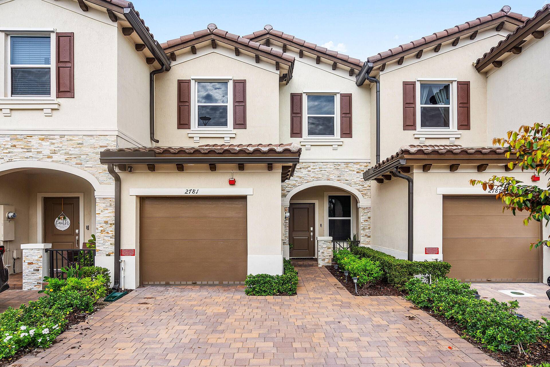 Brand new townhome for rent featuring a modern kitchen with quartz countertops and pantry space, tile floors downstairs, cozy carpet upstairs, and energy efficient A C.