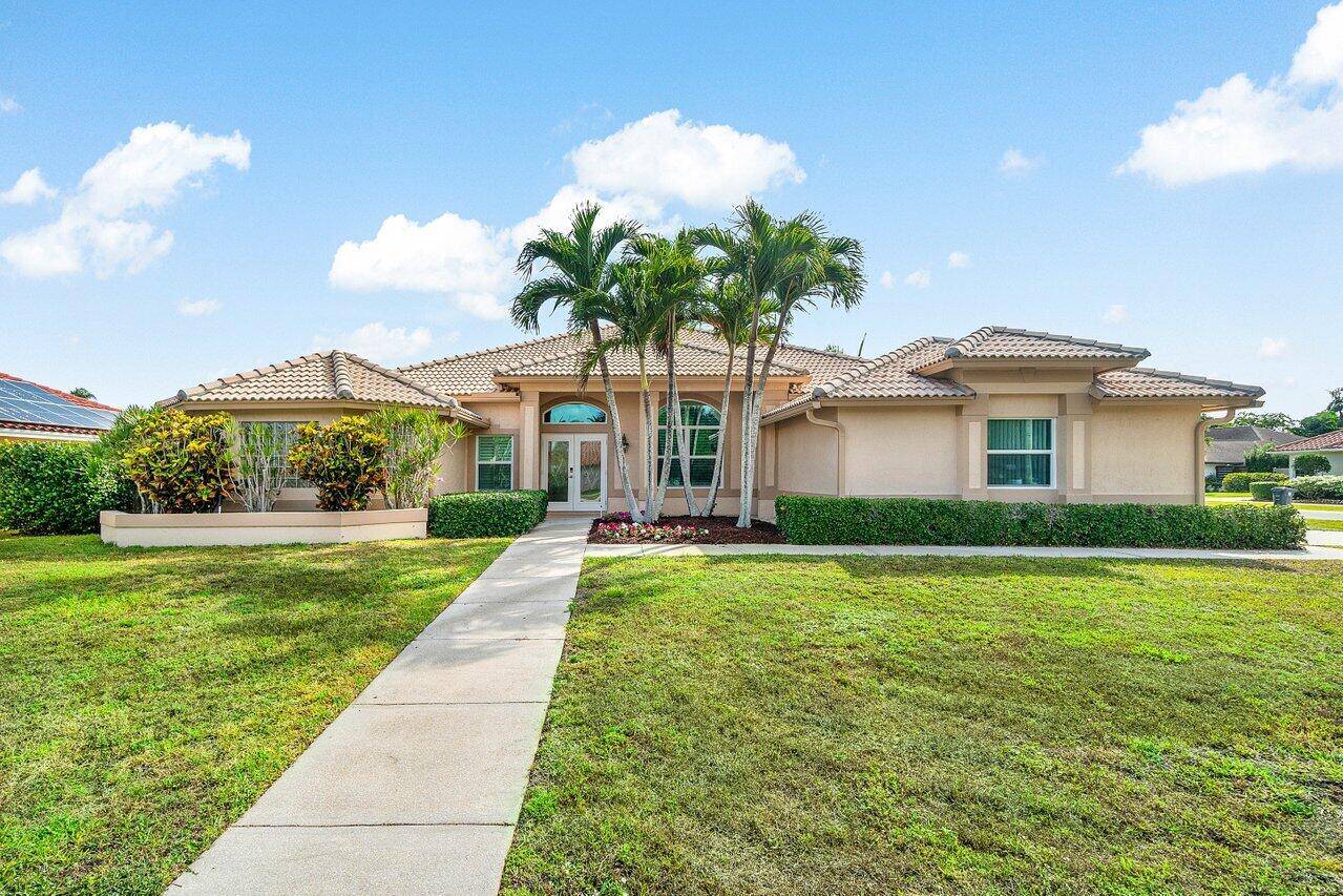 SPRAWLING SINGLE STORY CORNER LOT BRAND NEW IMPACT WINDOWS AND DOORS UPDATED BATHROOMS NO HOA !