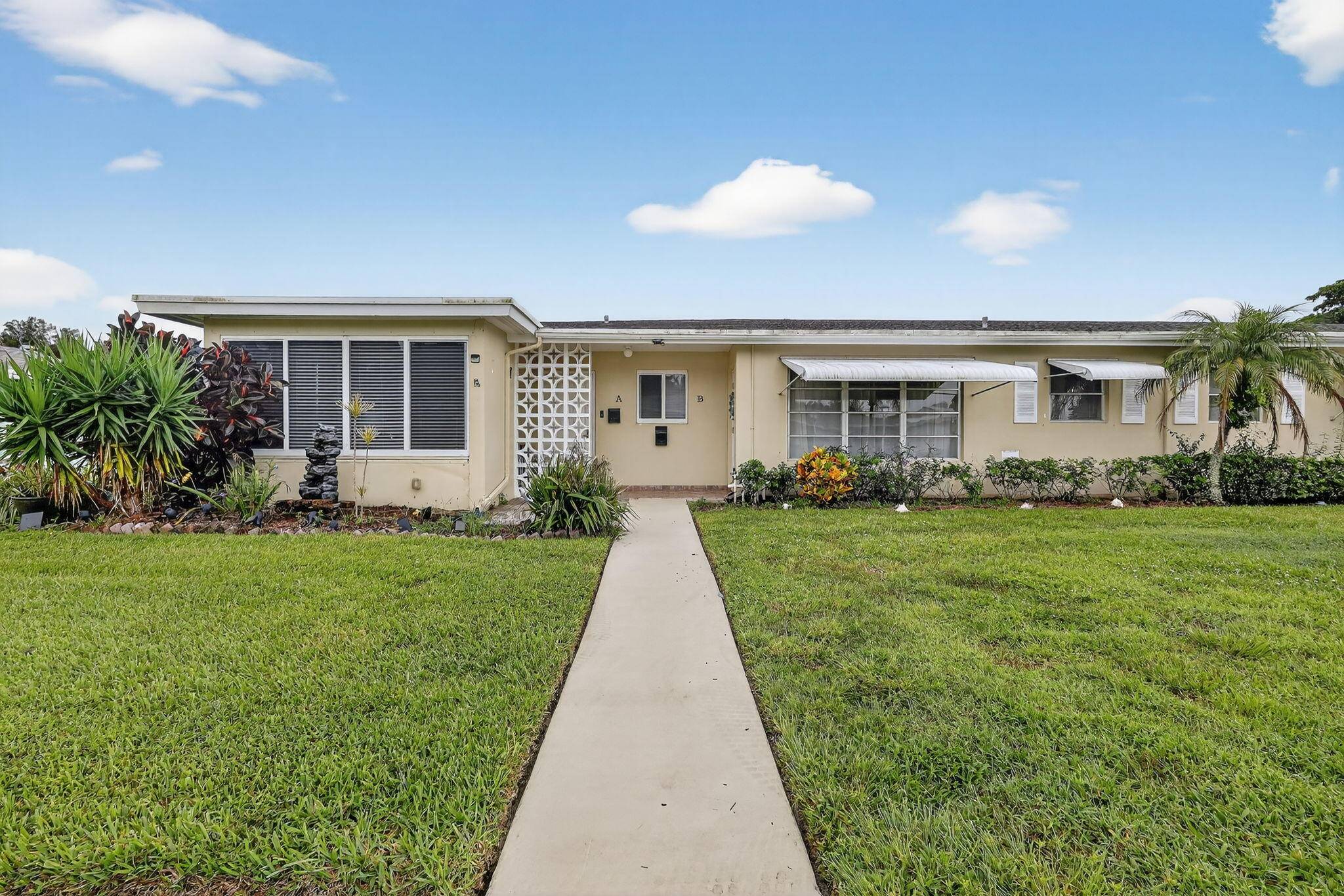 Stunning, updated furnished villa, in the vibrant 55 community of High Point, The open concept living and dining area, with ceramic tile, flows effortlessly.